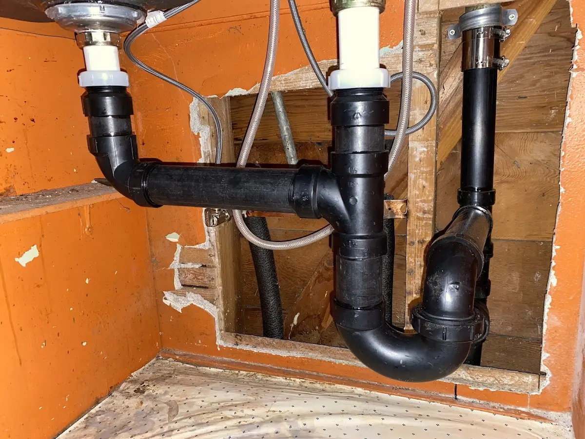 Professional Garbage Disposal Repair equipment and tools on the job in Cushing